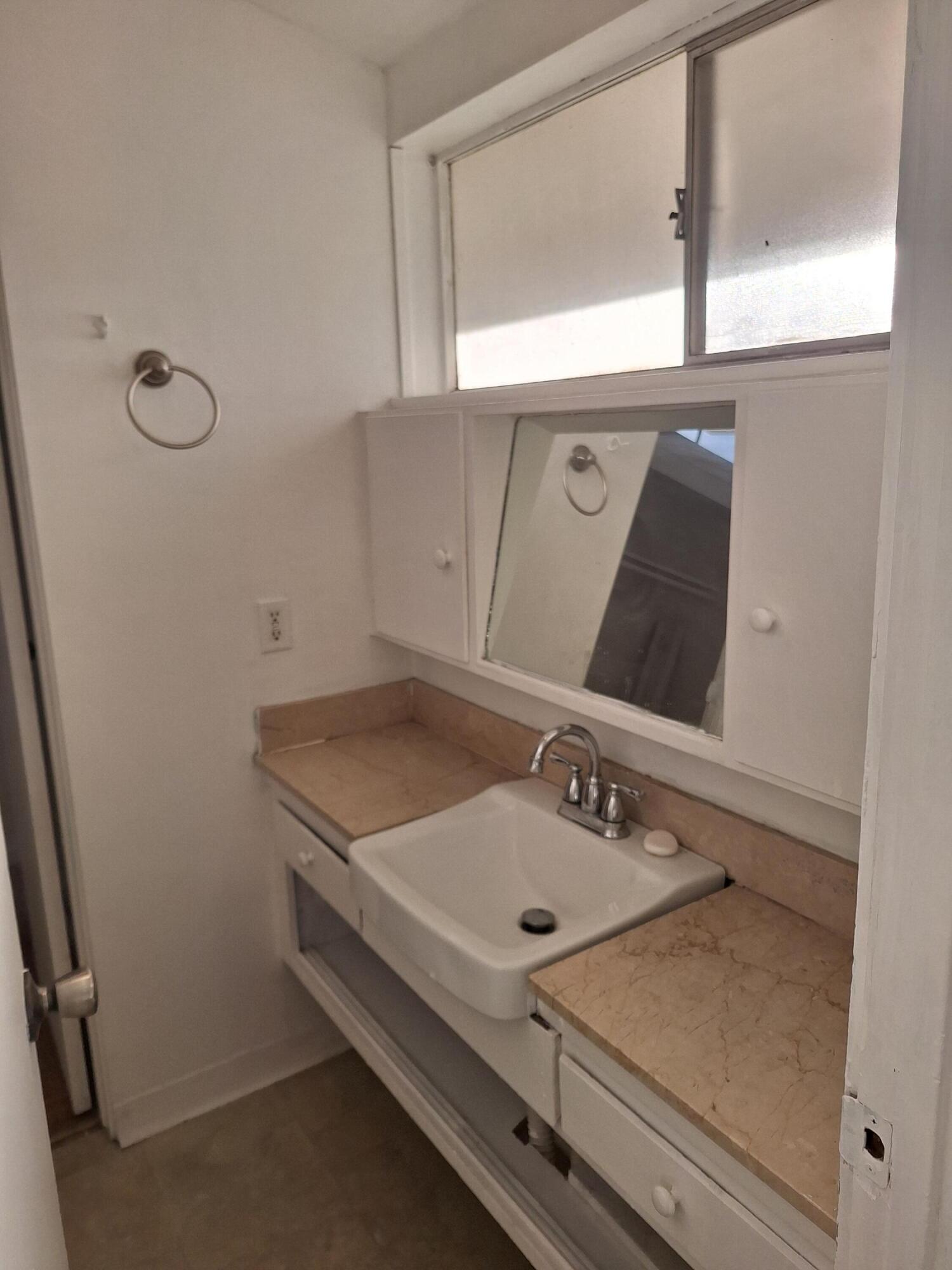 424 North Second Street Lompoc, CA 93436 - Photo 14 of 21 a bathroom with a sink and a mirror