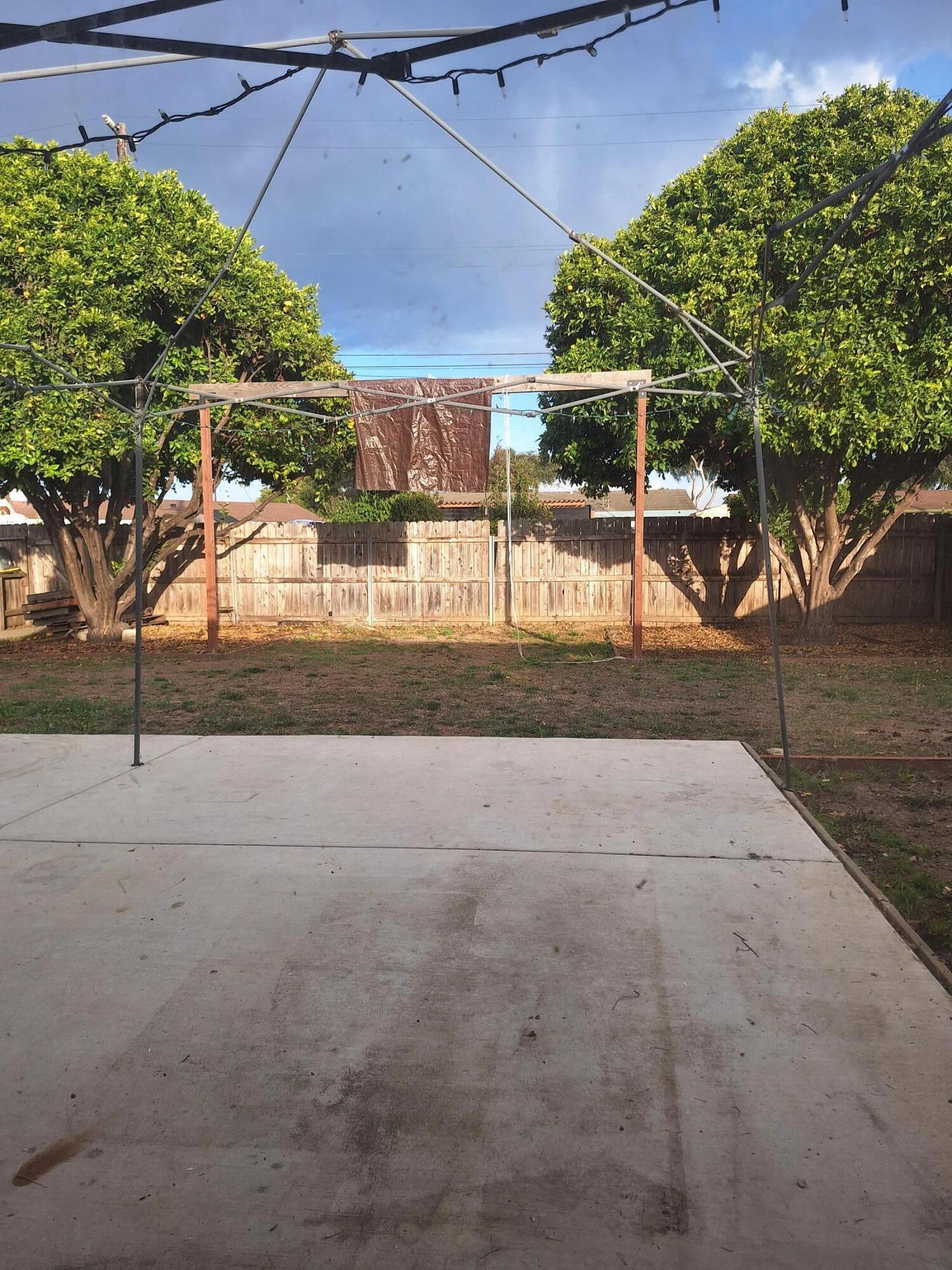 424 North Second Street Lompoc, CA 93436 - Photo 19 of 21 a view of a yard with an umbrella