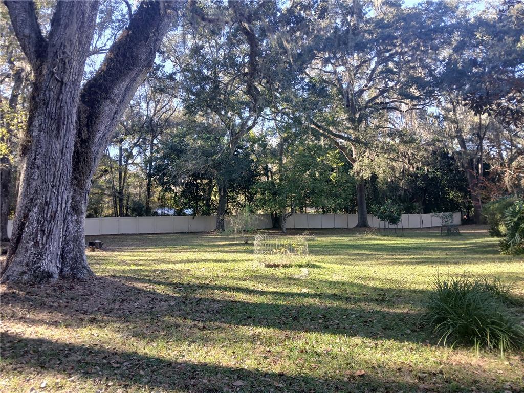 5497 West C Road Bushnell, FL 33513 - Photo 2 of 15 a view of a swimming pool and a yard