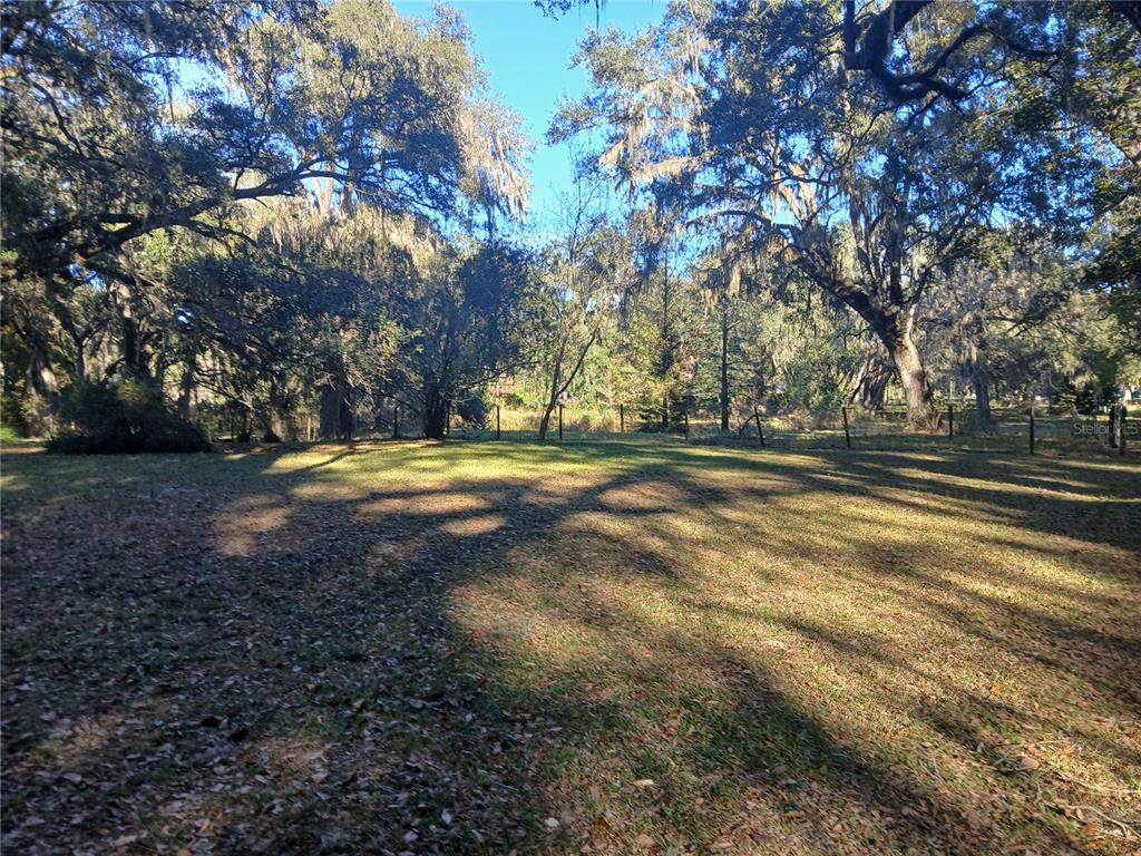 5497 West C Road Bushnell, FL 33513 - Photo 3 of 15 a view of outdoor space with yard