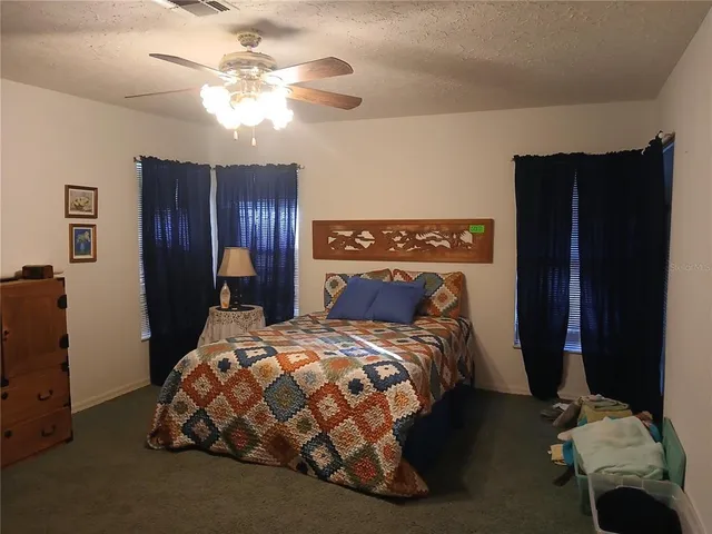 a bedroom with a bed and a closet