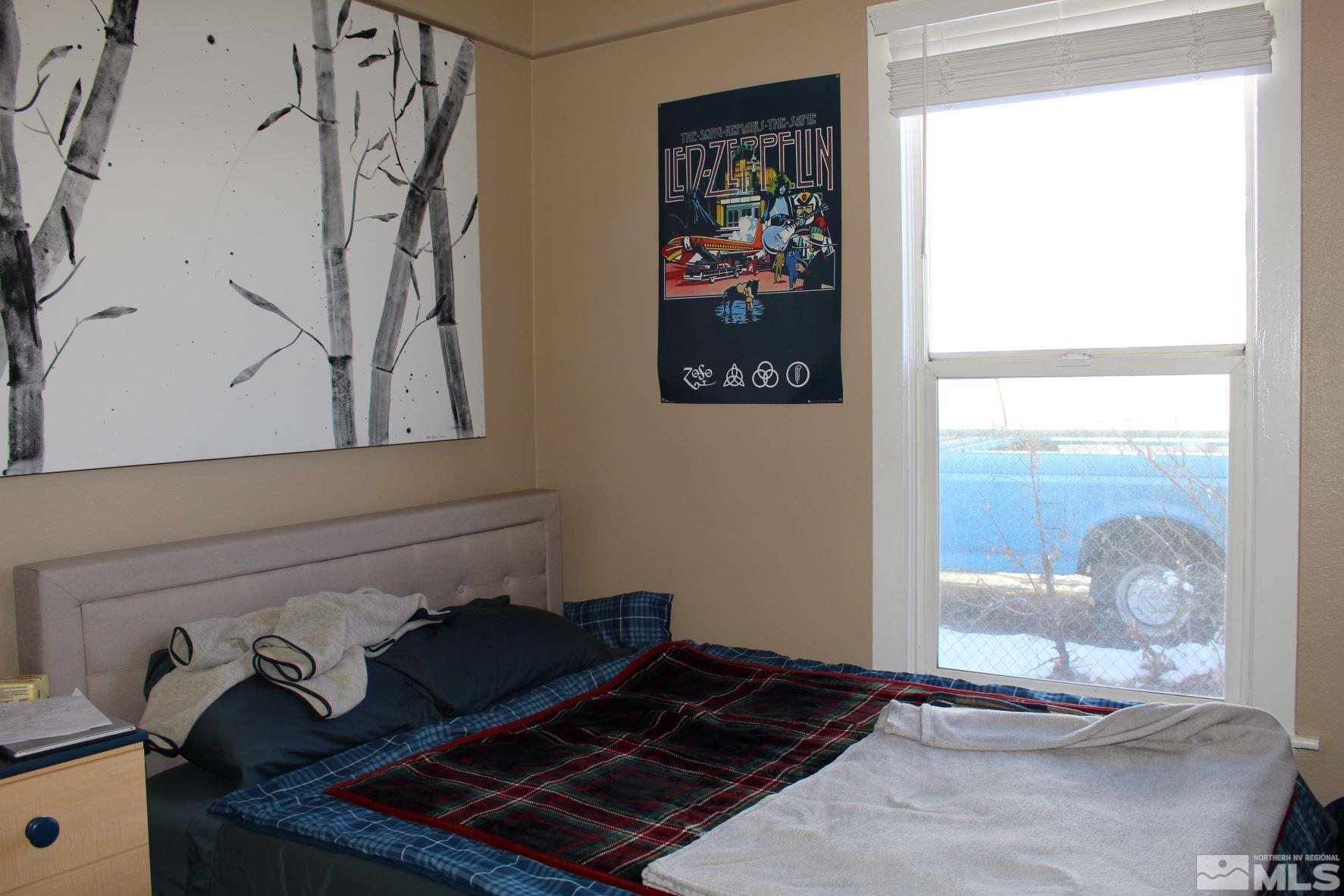 918 Washington Street Reno, NV 89503 - Photo 12 of 34 a room with lots of painting on the wall and a window