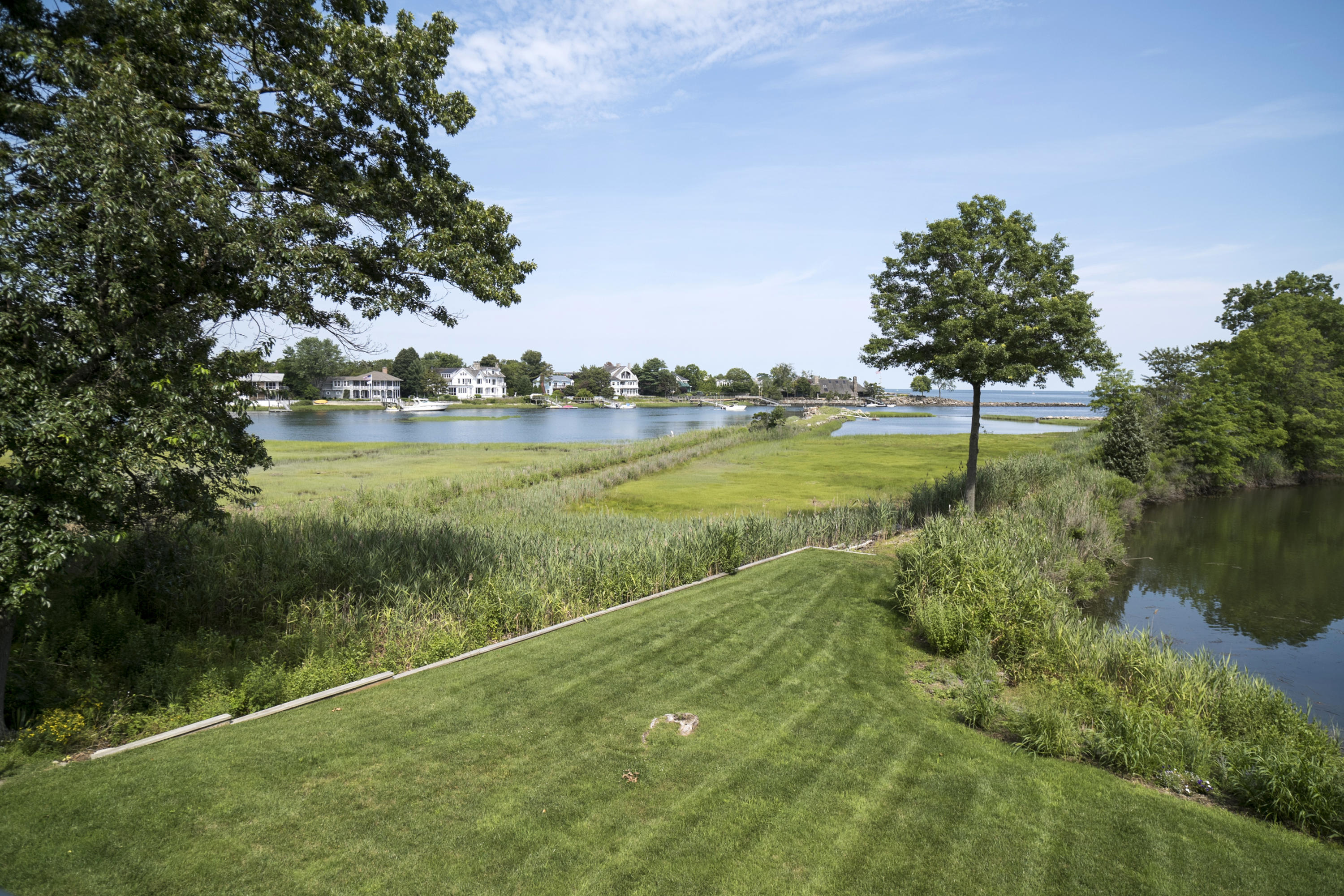 52 Shorehaven Road Westport, CT 06880 - Photo 11 of 37 a view of a lake with a big yard