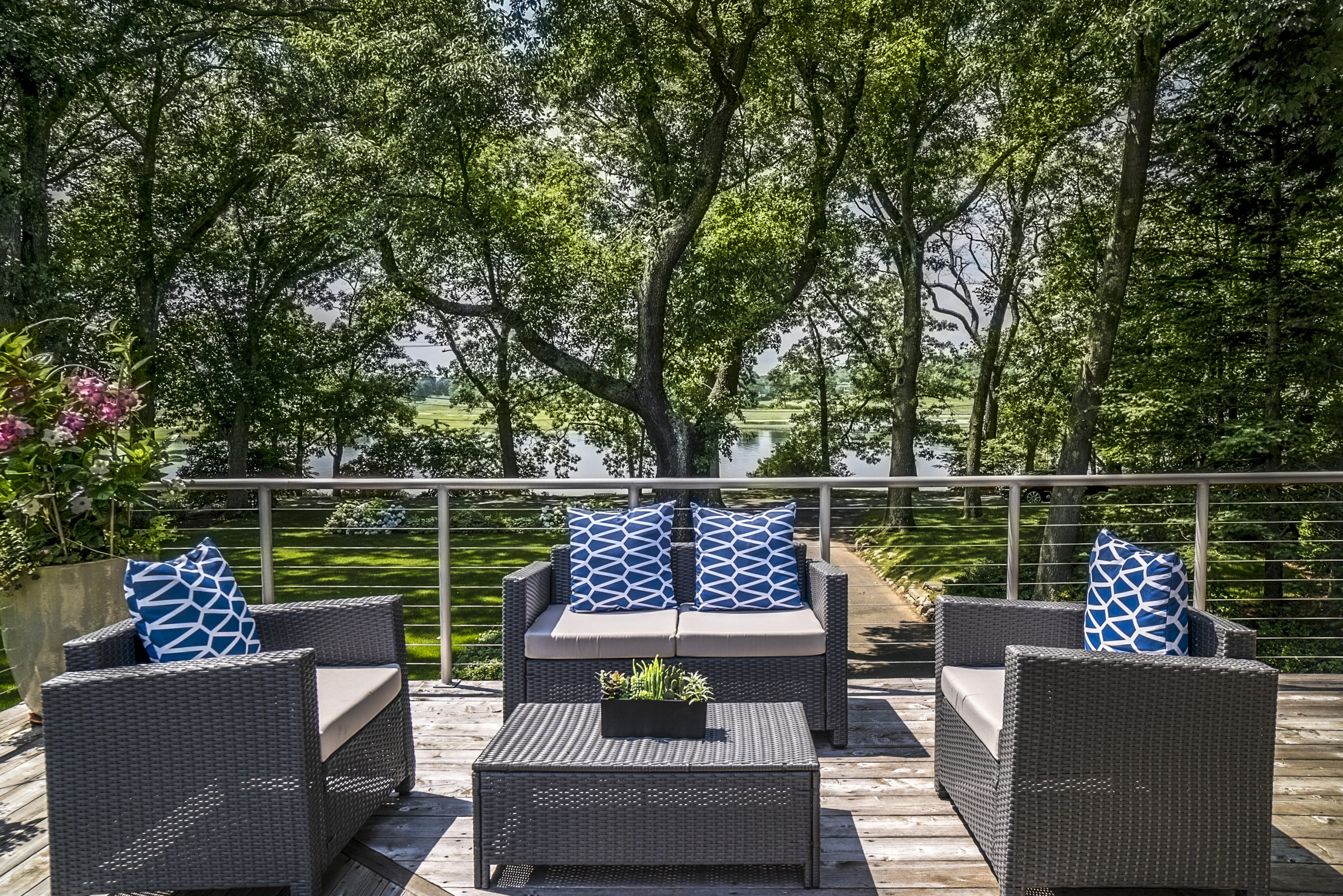 52 Shorehaven Road Westport, CT 06880 - Photo 17 of 37 a view of a deck with couches and a potted plant on a table with garden view