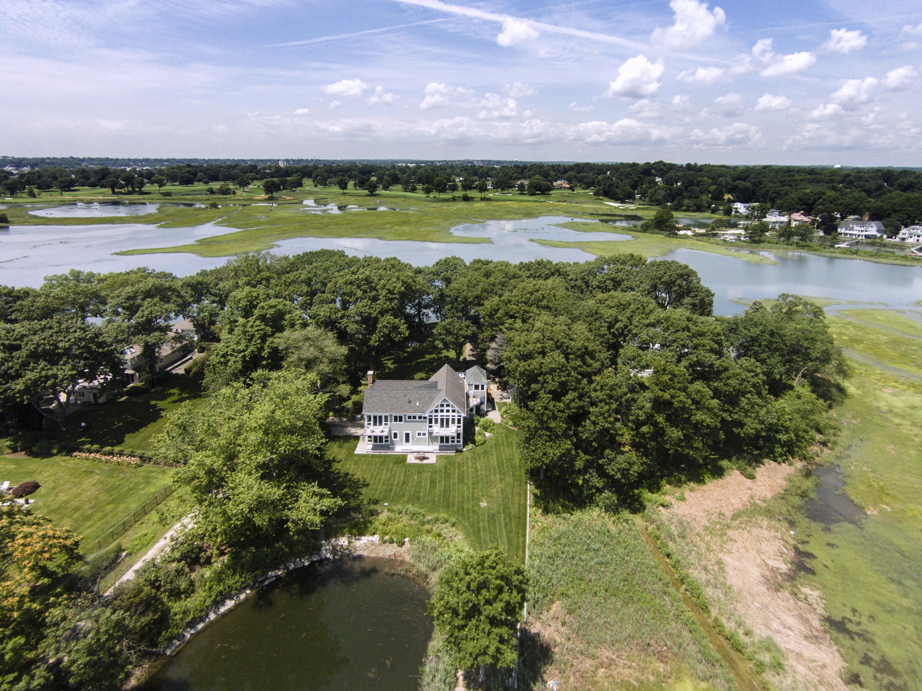 52 Shorehaven Road Westport, CT 06880 - Photo 2 of 37 a view of a city with a lake in the background