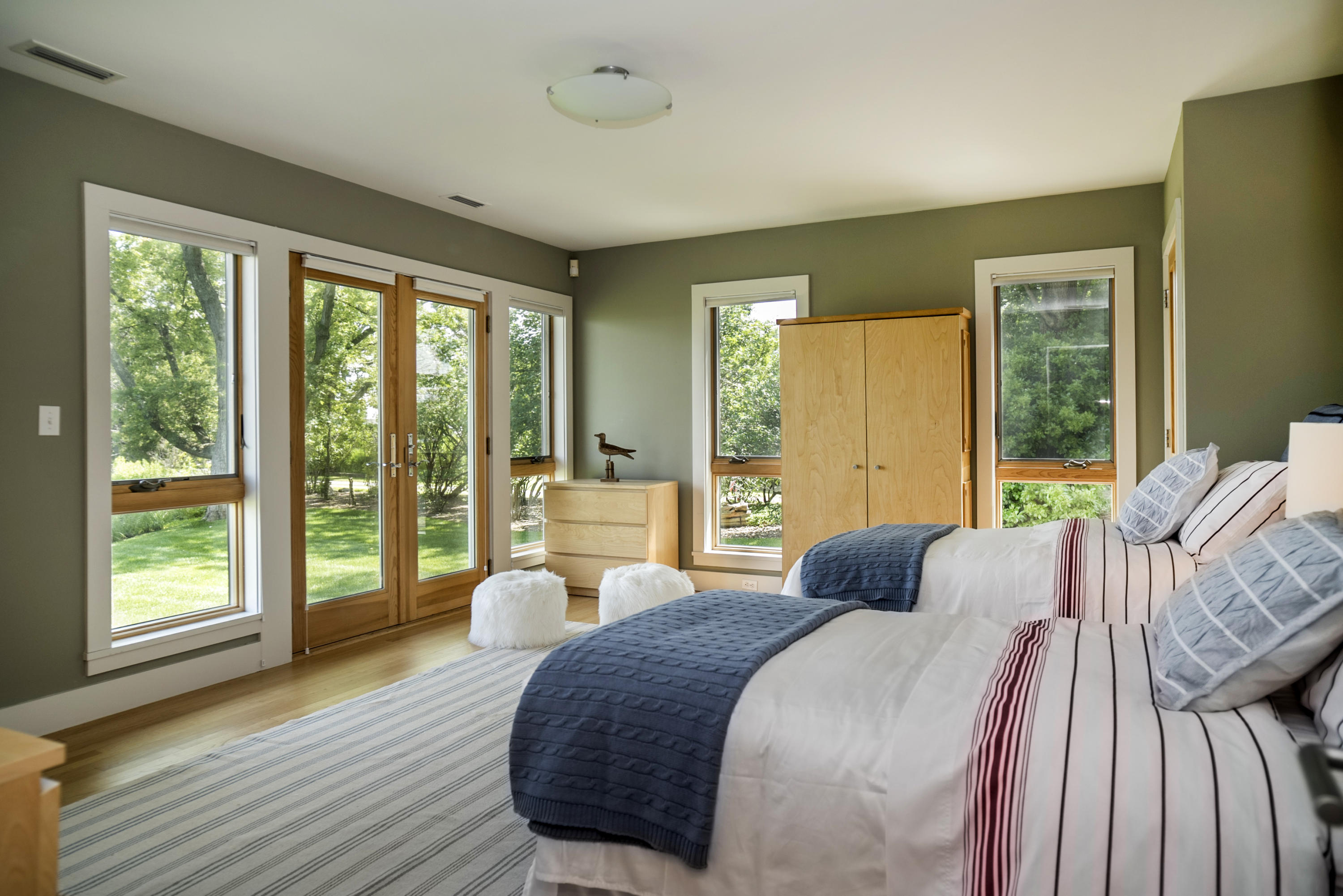52 Shorehaven Road Westport, CT 06880 - Photo 27 of 37 a bedroom with a bed and large windows