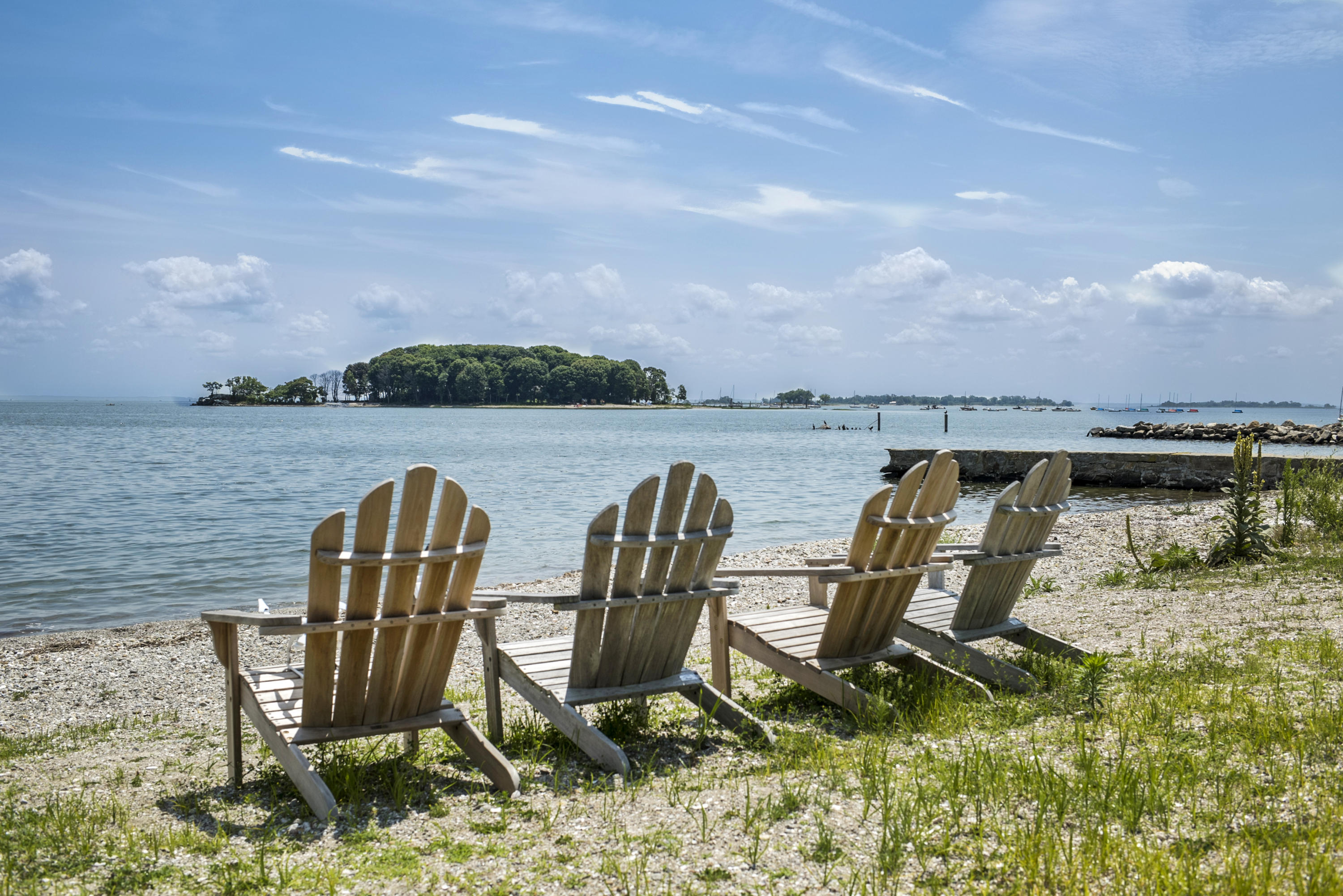 52 Shorehaven Road Westport, CT 06880 - Photo 35 of 37 a view of a lake with table and chairs