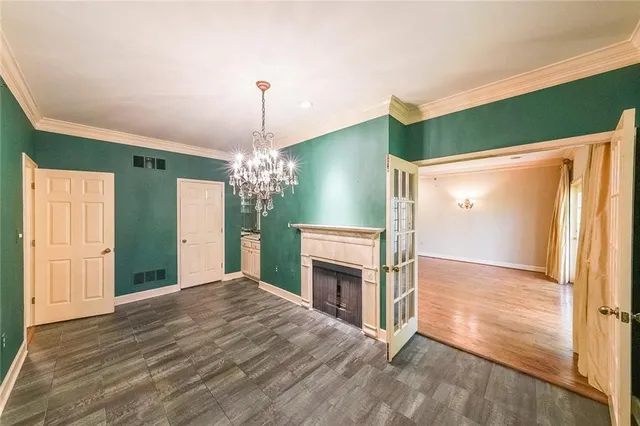 a view of a kitchen with refrigerator and a stove