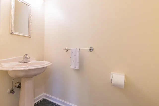 a bathroom with a sink a mirror and vanity