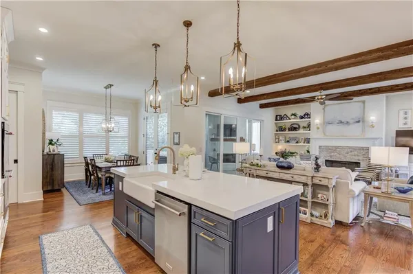 a large kitchen with a table and chairs