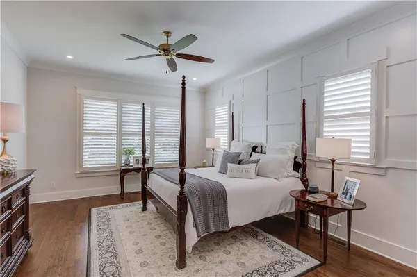 a bedroom with a bed and a table in it