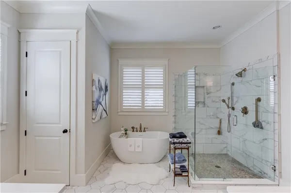 a bathroom with a bathtub and a shower