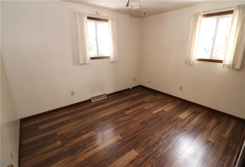 517 Sheldon Road Valencia, PA 16059 - Photo 14 of 25 Spacious third bedroom new laminate flooring and two views of the property.