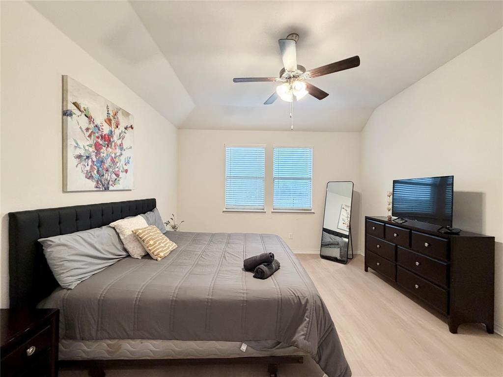 1041 Sublime Drive Forney, TX 75126 - Photo 16 of 26 a bedroom with a bed and dresser