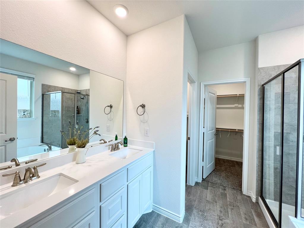 1041 Sublime Drive Forney, TX 75126 - Photo 17 of 26 a bathroom with a sink and a mirror