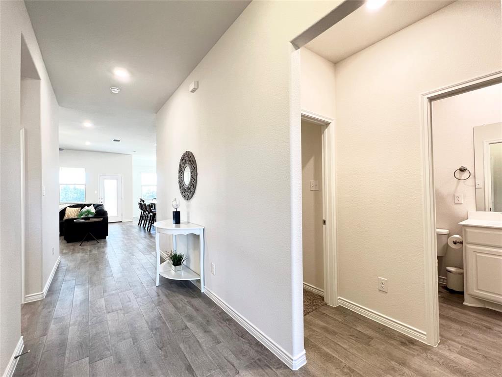 1041 Sublime Drive Forney, TX 75126 - Photo 2 of 26 a living room with furniture and a wooden floor
