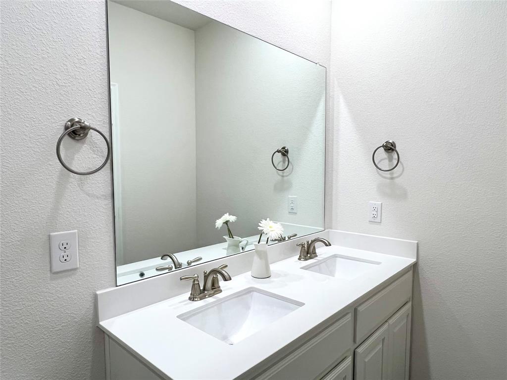 1041 Sublime Drive Forney, TX 75126 - Photo 23 of 26 a bathroom with a sink and mirror