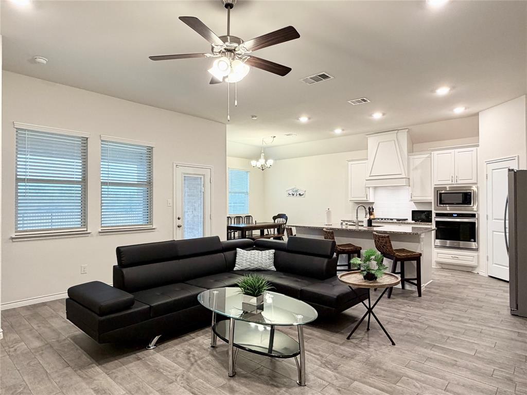 1041 Sublime Drive Forney, TX 75126 - Photo 6 of 26 a living room with furniture kitchen view and a window