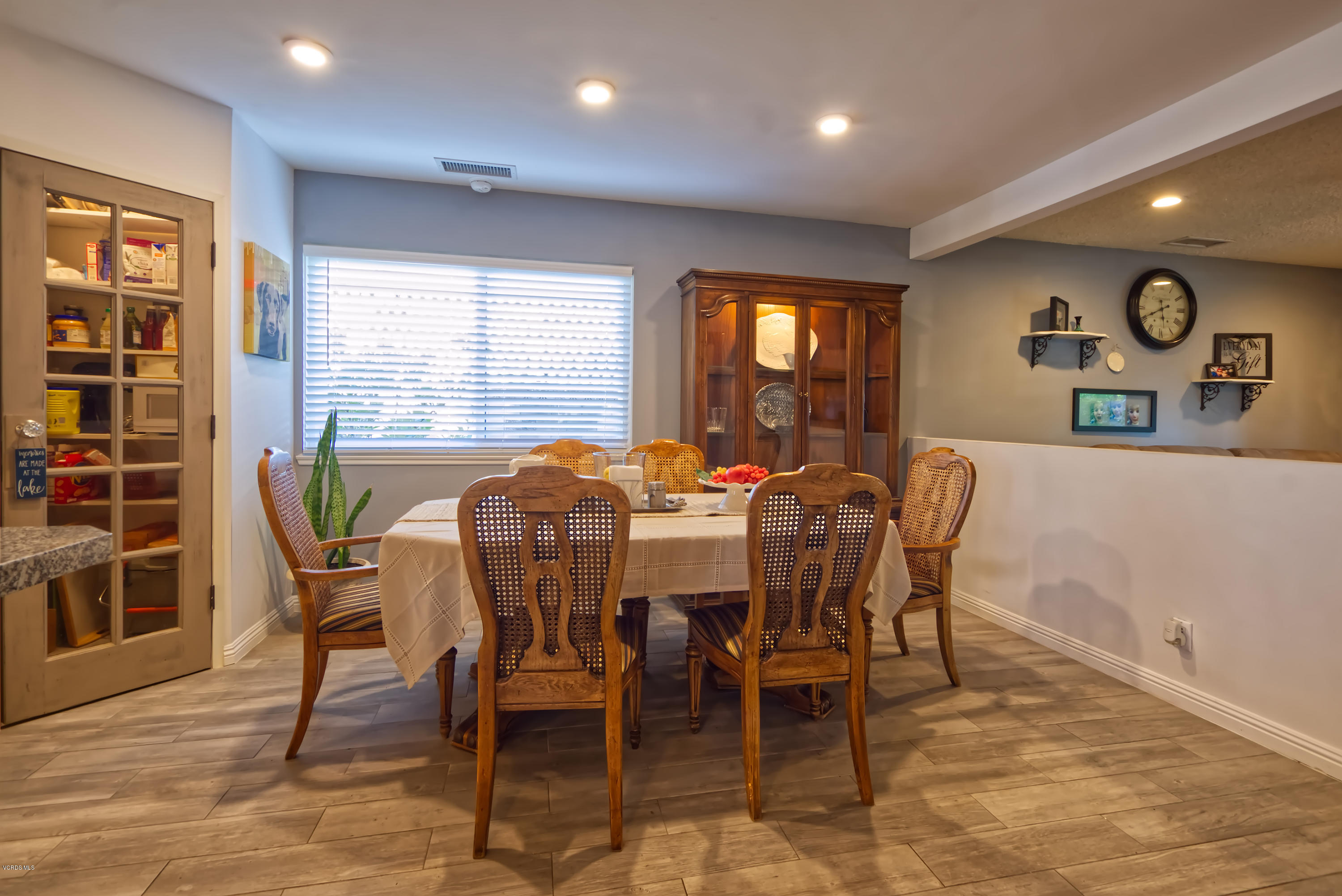 797 Appleton Road Simi Valley, CA 93065 - Photo 8 of 21 a view of a dining room with furniture window and wooden floor