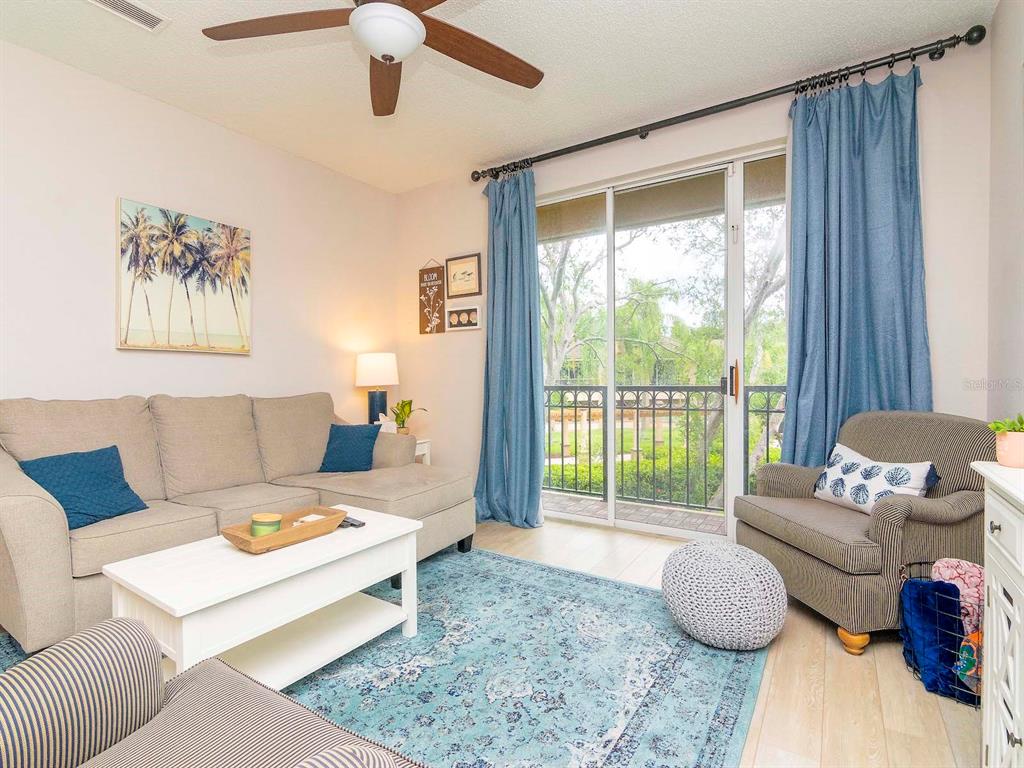 1036 Normandy Trace Road Tampa, FL 33602 - Photo 13 of 31 a living room with furniture and a large window