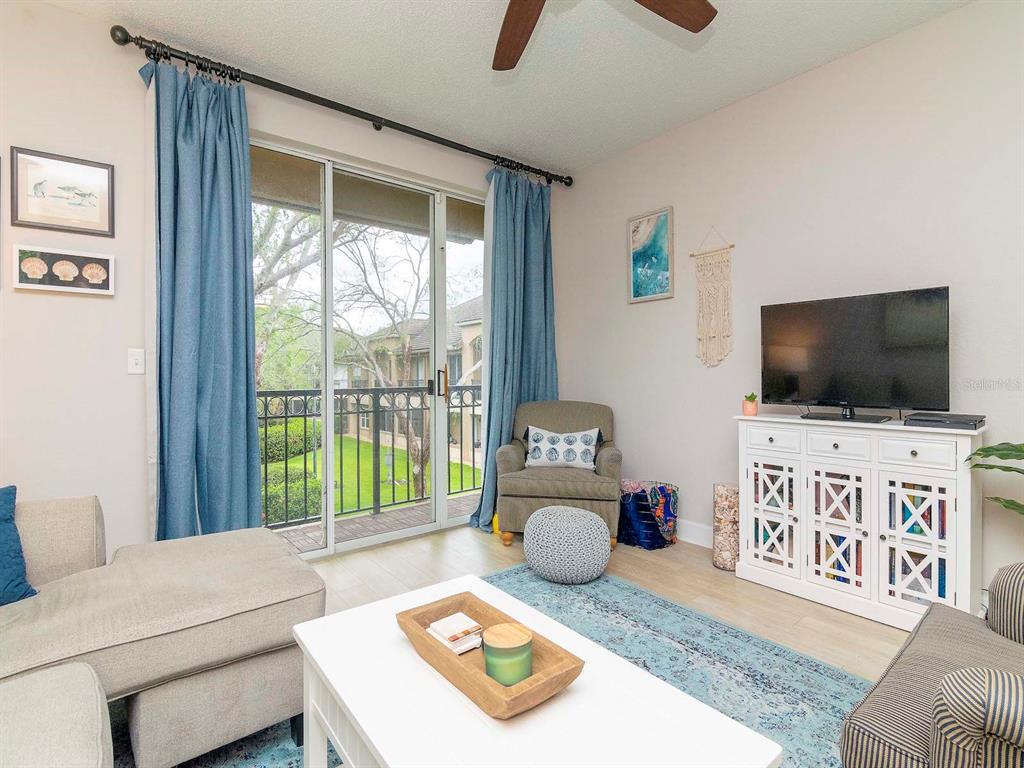 1036 Normandy Trace Road Tampa, FL 33602 - Photo 14 of 31 a living room with furniture and a flat screen tv
