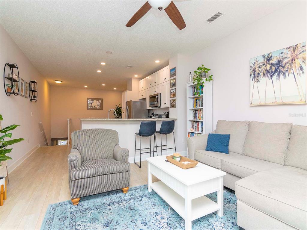 1036 Normandy Trace Road Tampa, FL 33602 - Photo 15 of 31 a living room with furniture and a rug