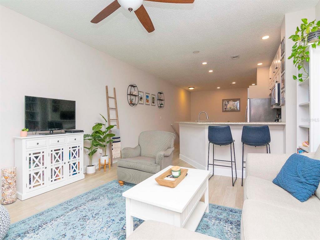 1036 Normandy Trace Road Tampa, FL 33602 - Photo 16 of 31 a living room with furniture and a flat screen tv