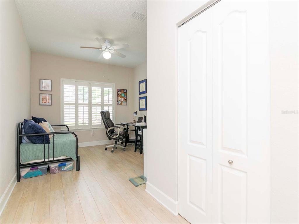1036 Normandy Trace Road Tampa, FL 33602 - Photo 17 of 31 a living room with furniture and a window
