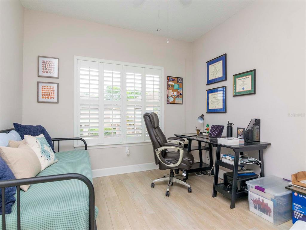 1036 Normandy Trace Road Tampa, FL 33602 - Photo 18 of 31 a view of a workspace with furniture and a window