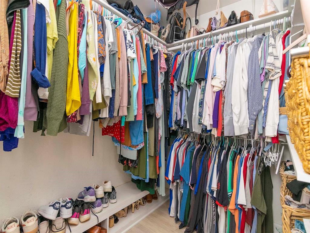 1036 Normandy Trace Road Tampa, FL 33602 - Photo 22 of 31 a view of walk in closet with clothes and shoes