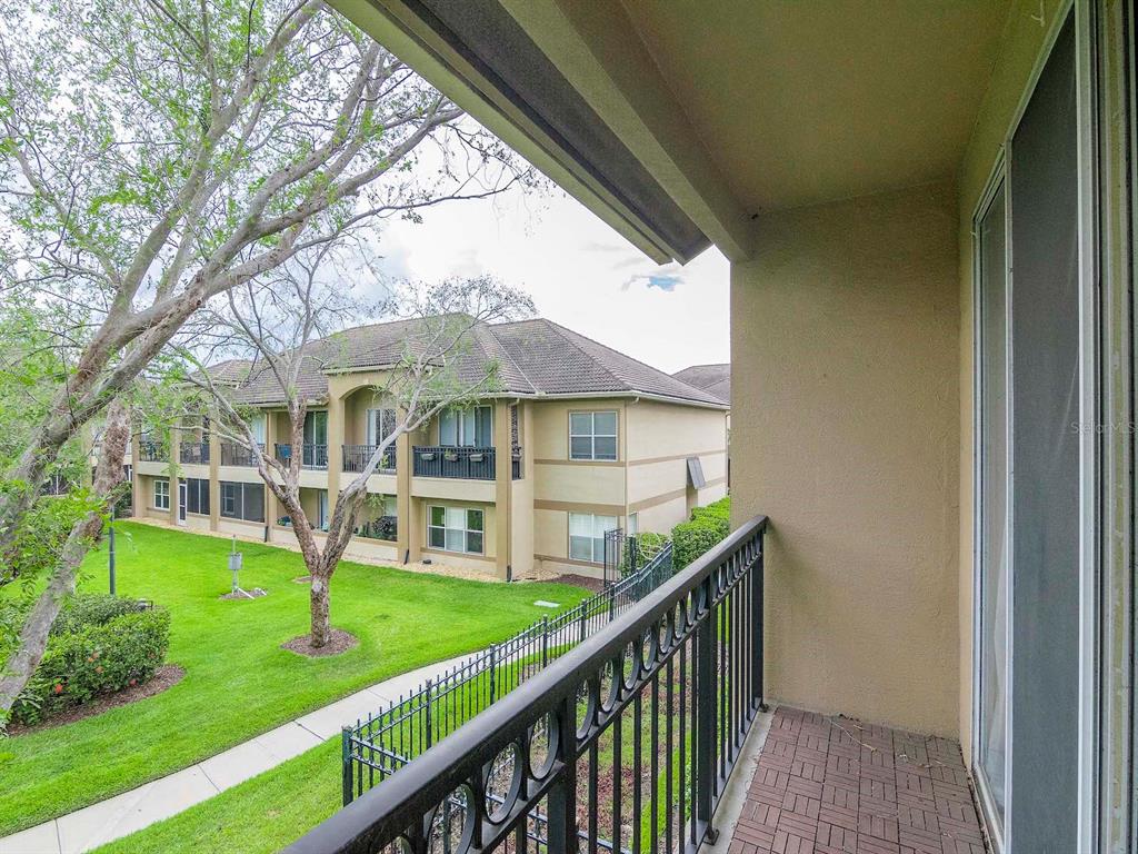 1036 Normandy Trace Road Tampa, FL 33602 - Photo 25 of 31 a view of an house with backyard porch and sitting area