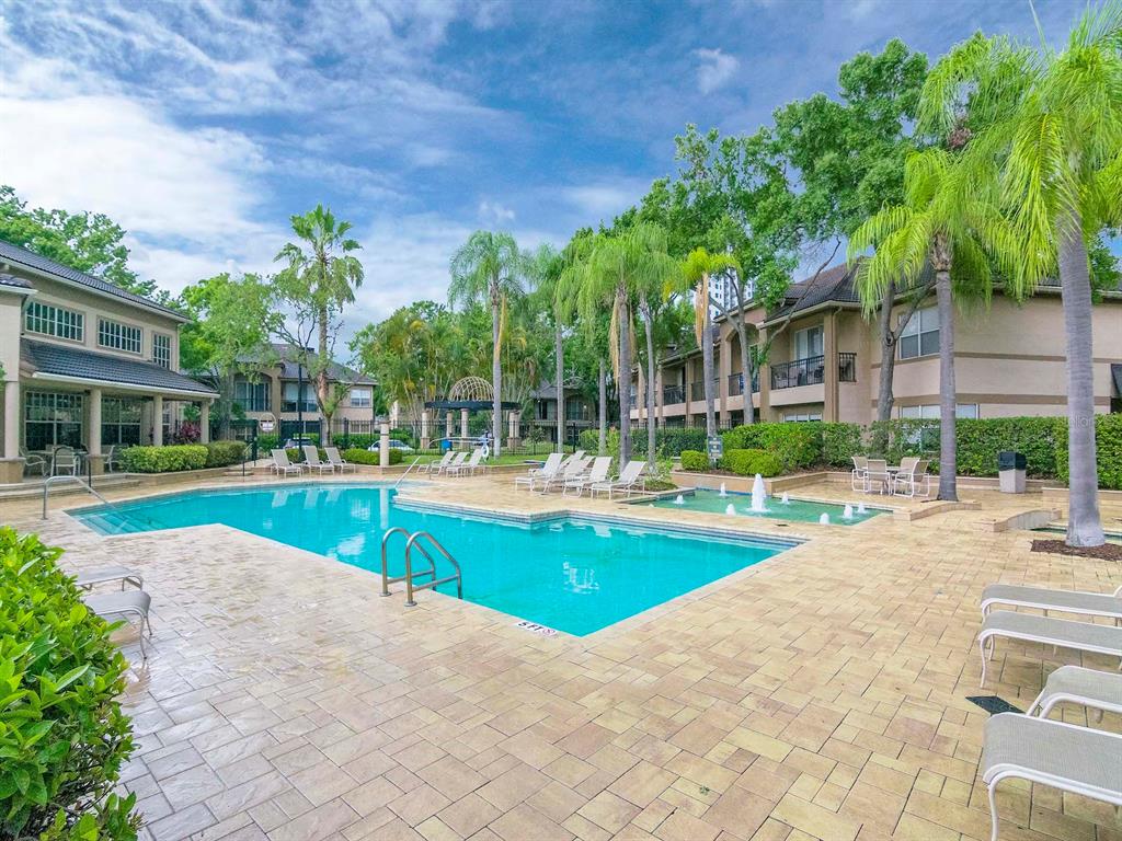 1036 Normandy Trace Road Tampa, FL 33602 - Photo 27 of 31 a view of swimming pool with lawn chairs and plants