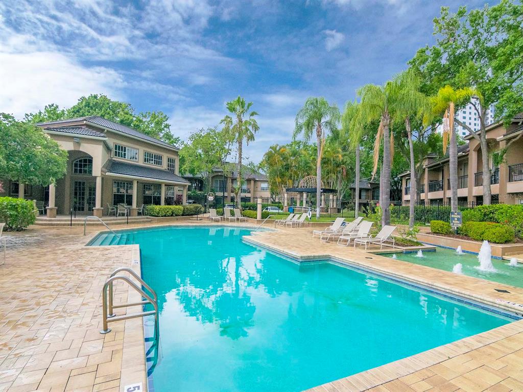 1036 Normandy Trace Road Tampa, FL 33602 - Photo 28 of 31 a view of swimming pool with lawn chairs and plants
