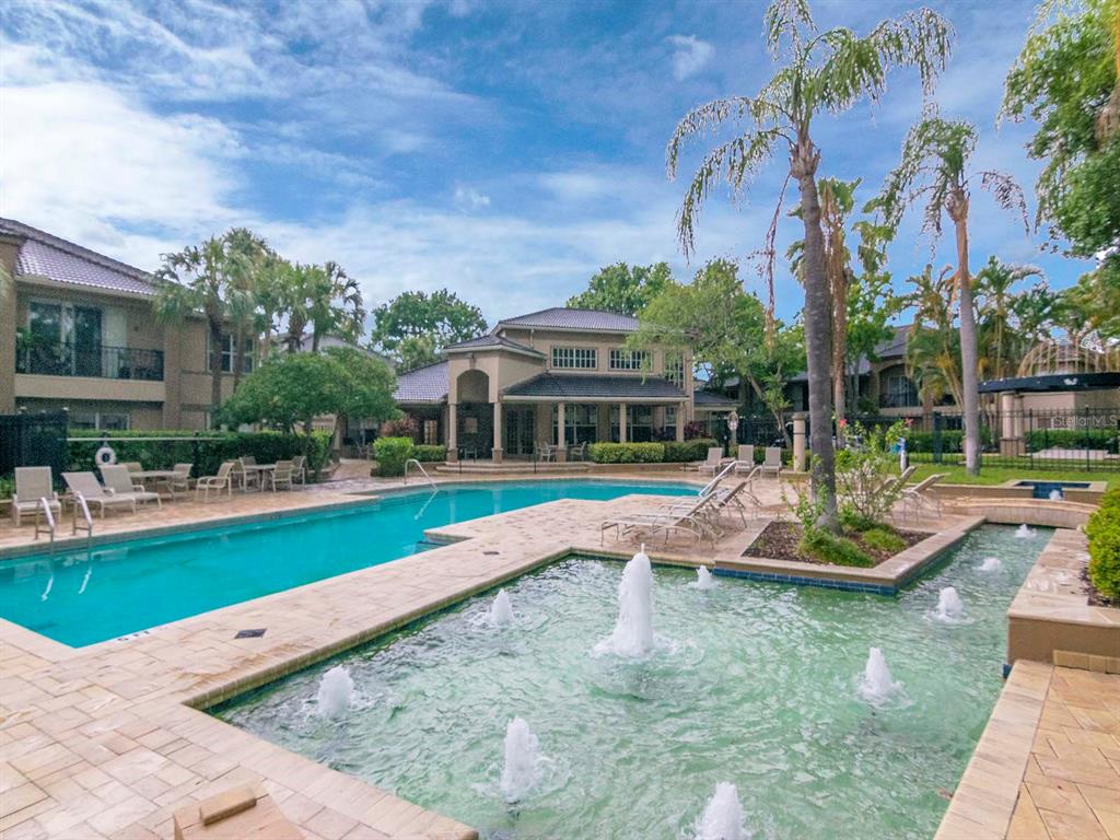 1036 Normandy Trace Road Tampa, FL 33602 - Photo 29 of 31 a view of a house with swimming pool and a yard