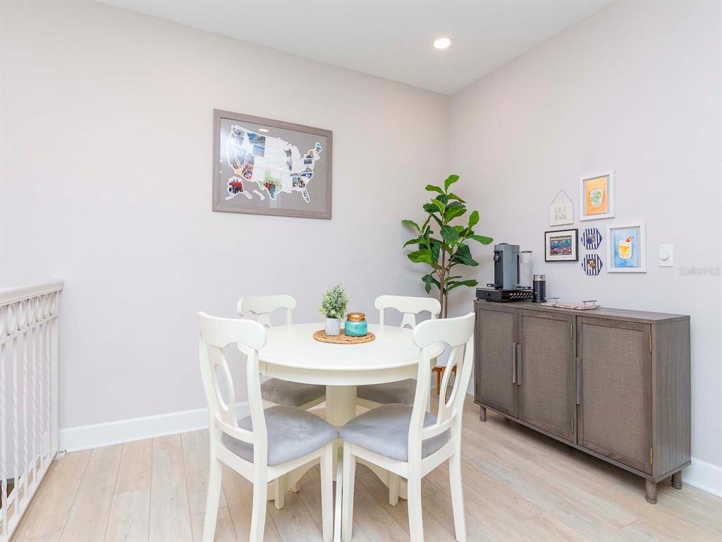 1036 Normandy Trace Road Tampa, FL 33602 - Photo 4 of 31 a view of a dining room with furniture and a potted plant
