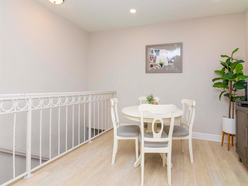 1036 Normandy Trace Road Tampa, FL 33602 - Photo 5 of 31 a view of a dining room with furniture window and wooden floor