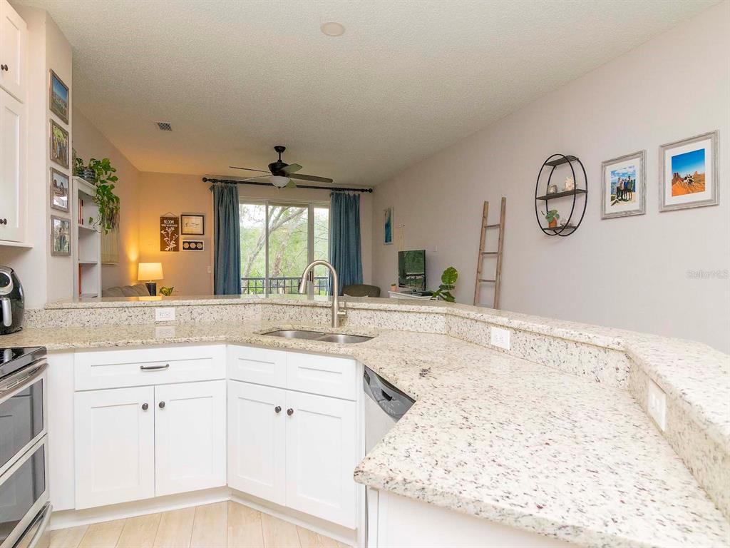 1036 Normandy Trace Road Tampa, FL 33602 - Photo 8 of 31 a bathroom with a granite countertop sink mirror and vanity