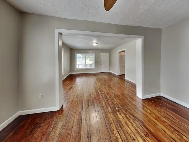 a view of house with a large window and stairs