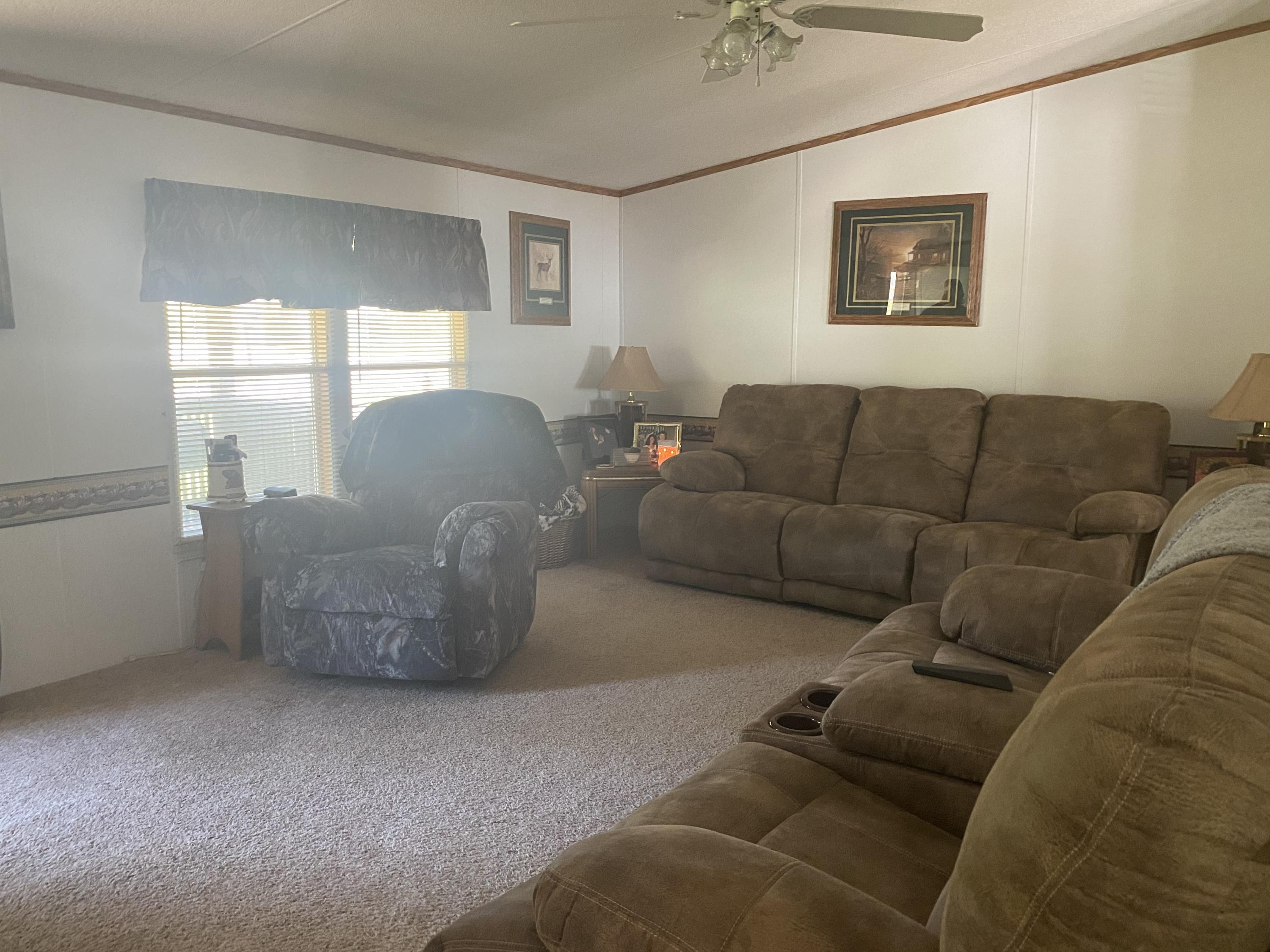 106 Brake Road Elliston, VA 24087 - Photo 2 of 13 a living room with furniture and a window