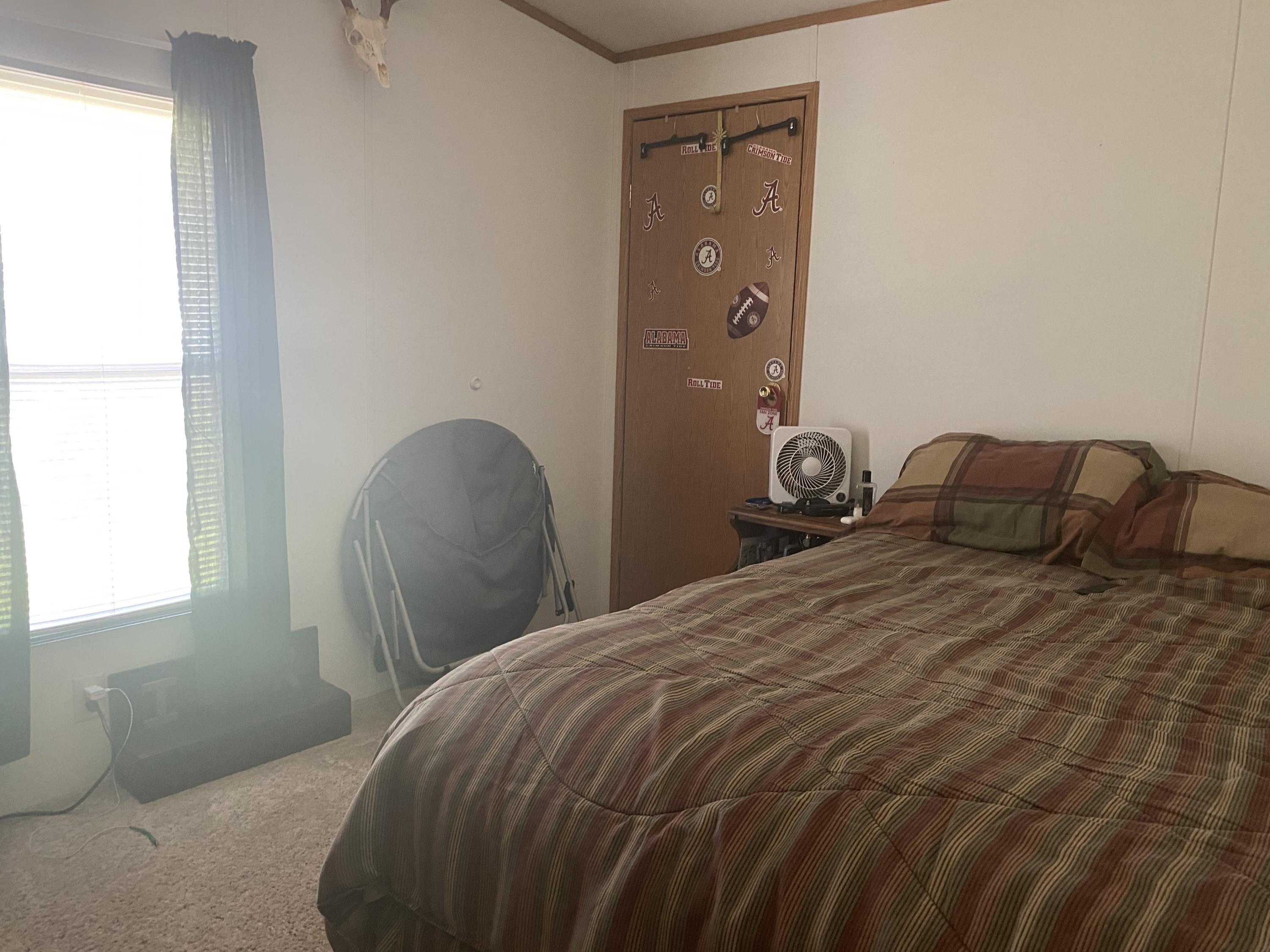 106 Brake Road Elliston, VA 24087 - Photo 6 of 13 a bedroom with a bed and window