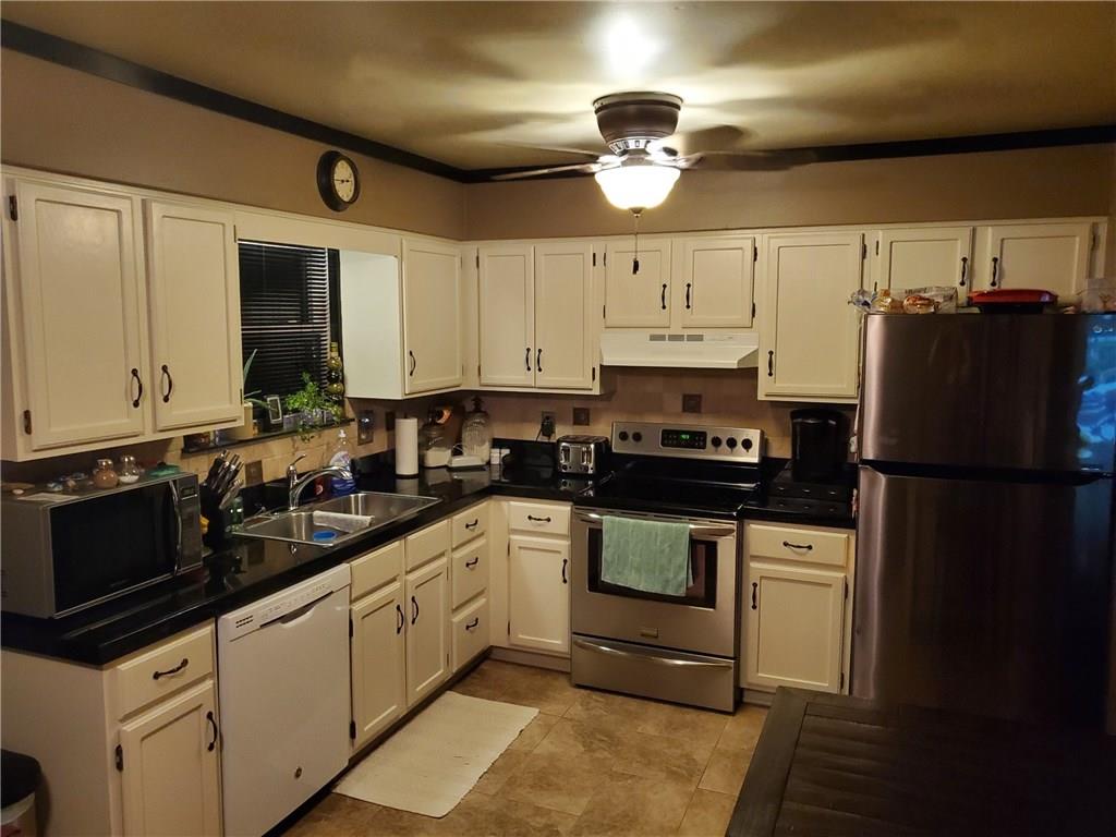 119 North Eberhart Road Butler, PA 16001 - Photo 2 of 18 New ceramic tiled countertops and flooring.