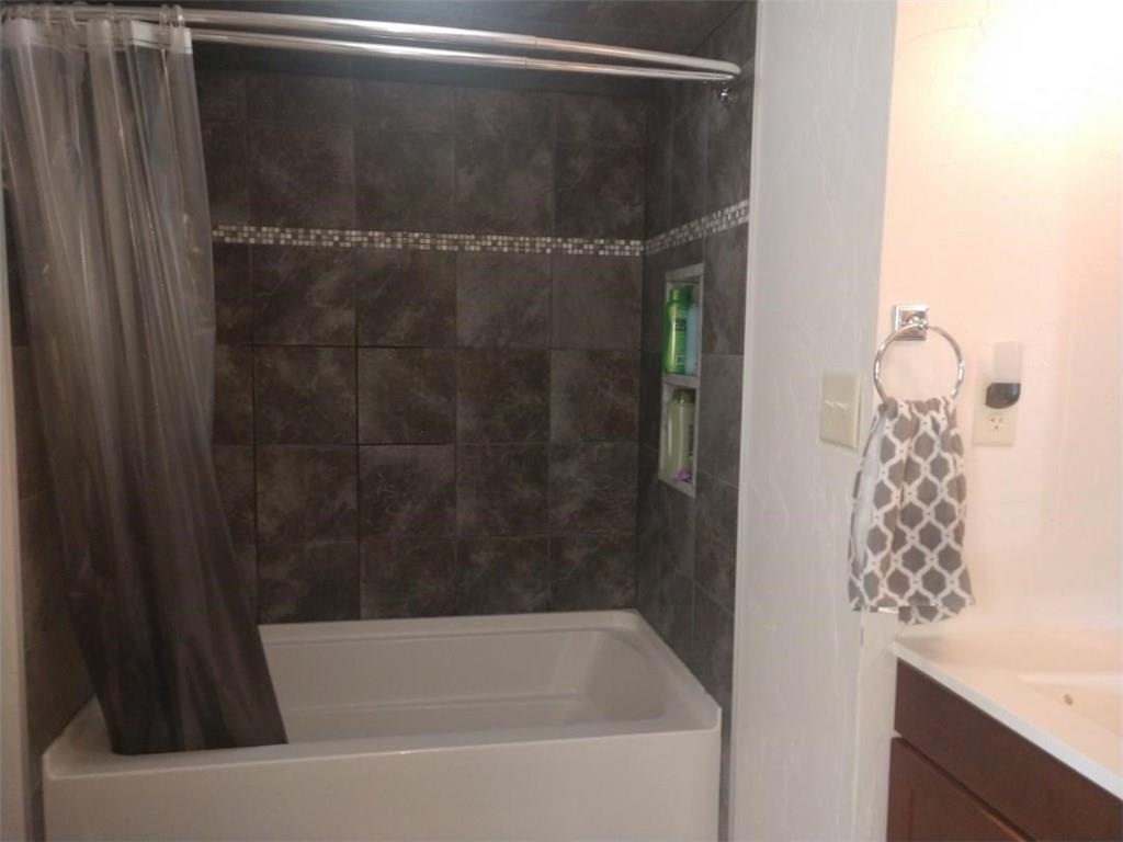 119 North Eberhart Road Butler, PA 16001 - Photo 11 of 18 The lower level bathroom has a deep soaking tub, tiled walls, niches.