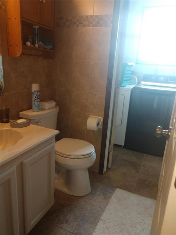 119 North Eberhart Road Butler, PA 16001 - Photo 7 of 18 An update bath room with tiled walls ,floors and bath surround .