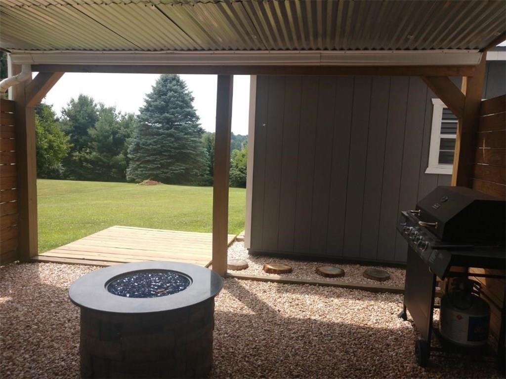 119 North Eberhart Road Butler, PA 16001 - Photo 10 of 18 The covered patio walks out to the expansive yard.