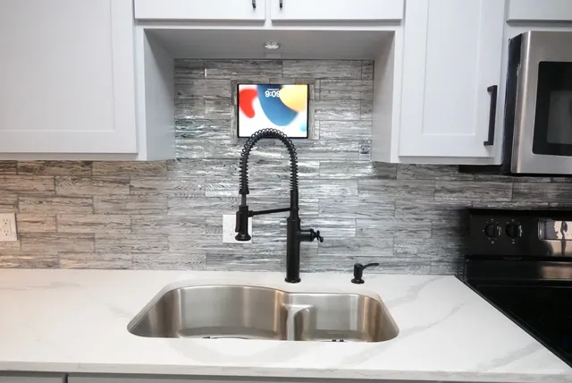 a sink with a kitchen island