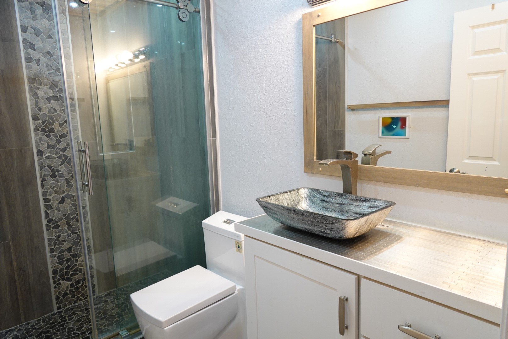 2714 Vienna Place Pasadena, TX 77502 - Photo 9 of 12 a bathroom with a sink a toilet and shower