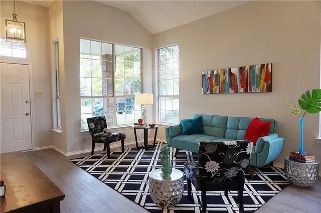 a living room with furniture and a window