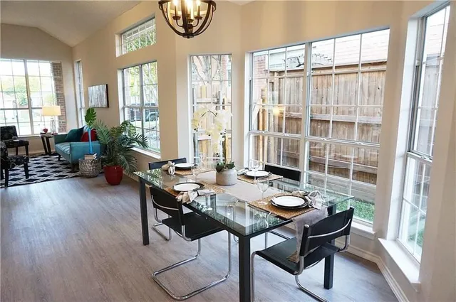 a view of a livingroom with furniture and a window
