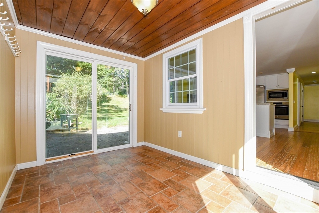 1251 Broadway Hanover, MA 02339 - Photo 13 of 39 a view of empty room with wooden floor and fan