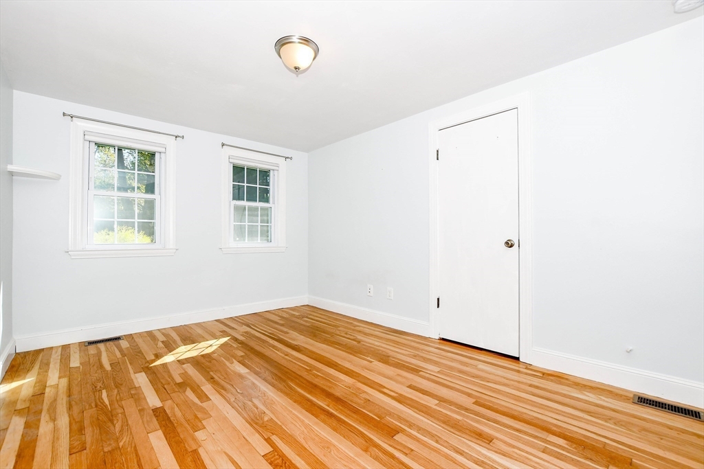 1251 Broadway Hanover, MA 02339 - Photo 15 of 39 a view of empty room with wooden floor